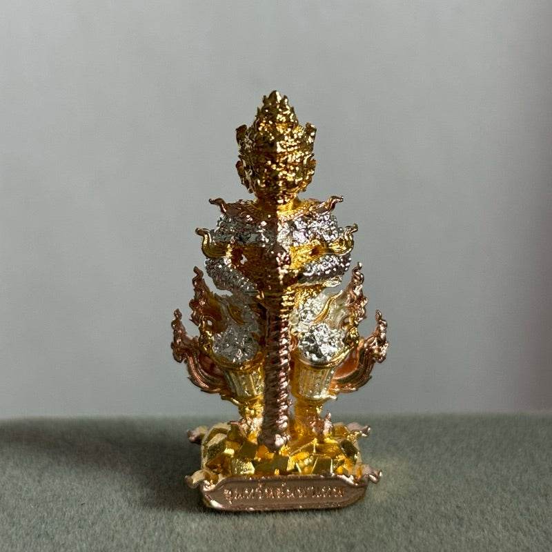Ornate gold and silver Thao Wessuwan amulet Wat Suthat statue on decorative base for home altar