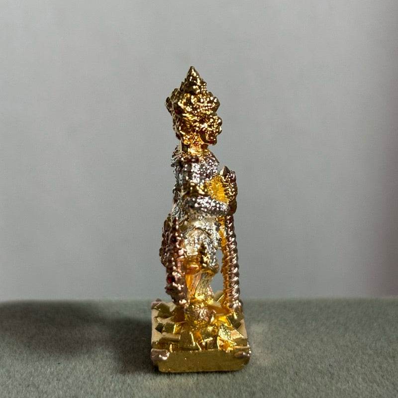 Small gold and silver Thao Wessuwan amulet Wat Suthat statue standing on pedestal for home altar