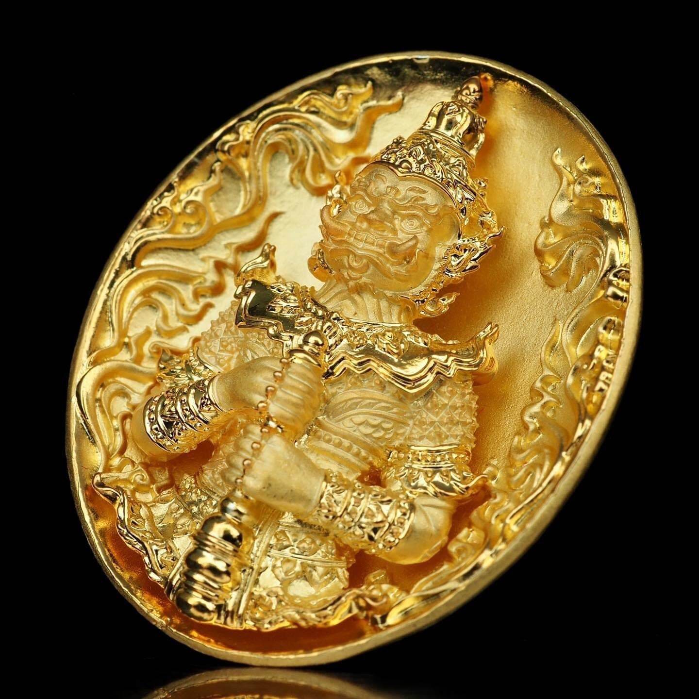 Gold round amulet medallion with ornate guardian figure holding club Thao Wessuwanno Bandarn Patthanapon