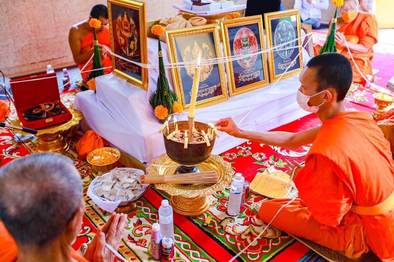 Thao Wessuwanno Bandarn Patthanapon amulet ceremony scene with orange robed monks and sacred offerings