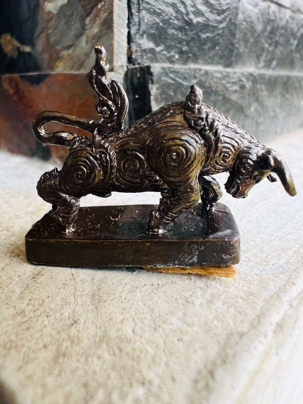 Wua Thanu Thai protection amulet bronze buffalo figurine with spiral patterns on rectangular base
