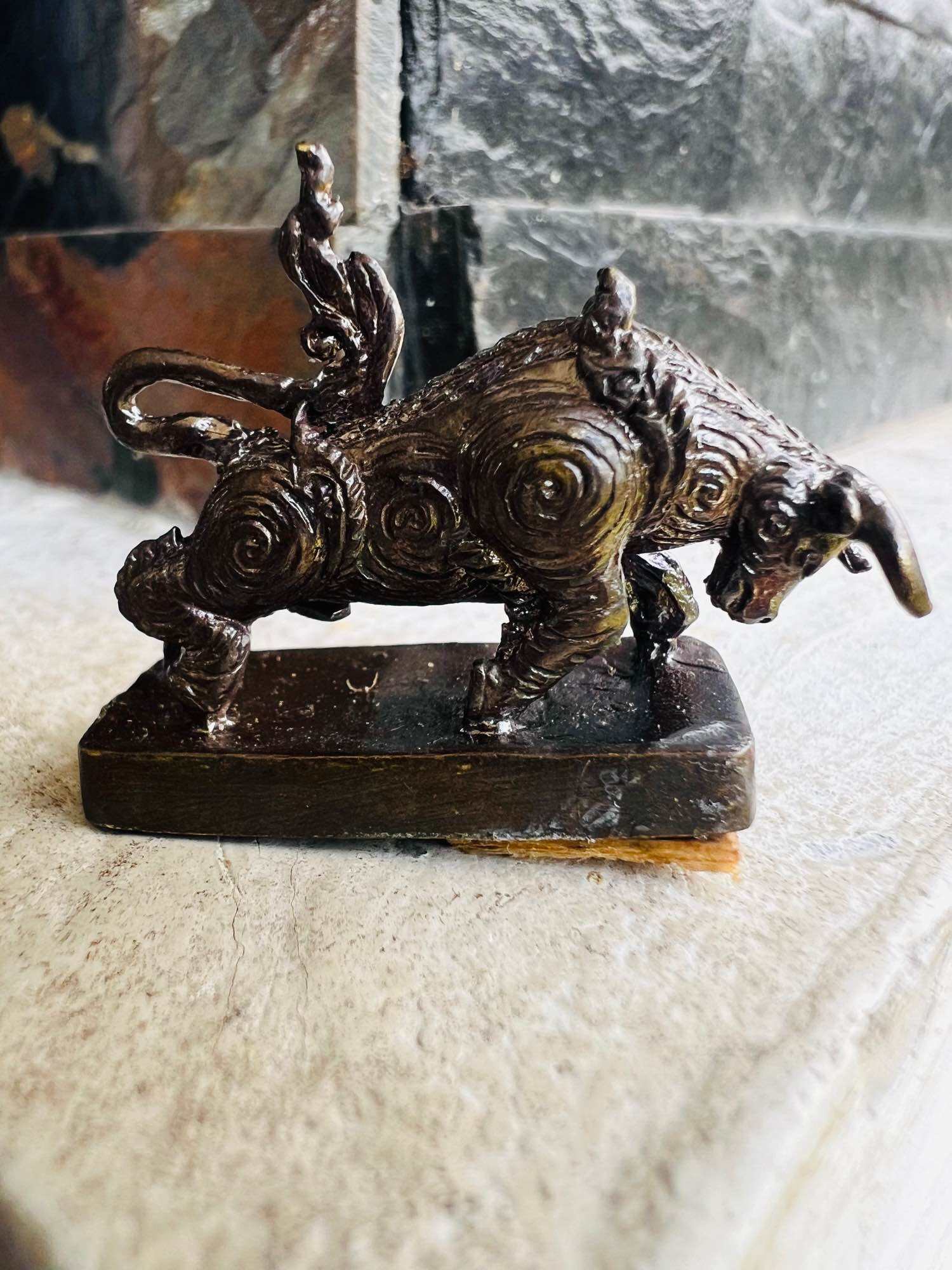 Wua Thanu Thai protection amulet bronze buffalo figurine with spiral patterns on rectangular base