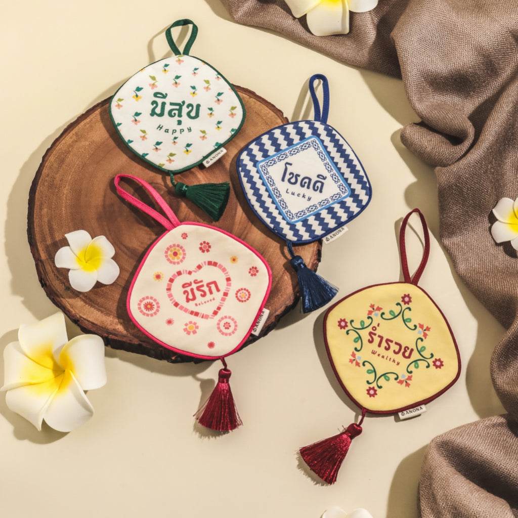 Aromatherapy gift box for women and men featuring colorful fabric sachets with floral designs and Thai script