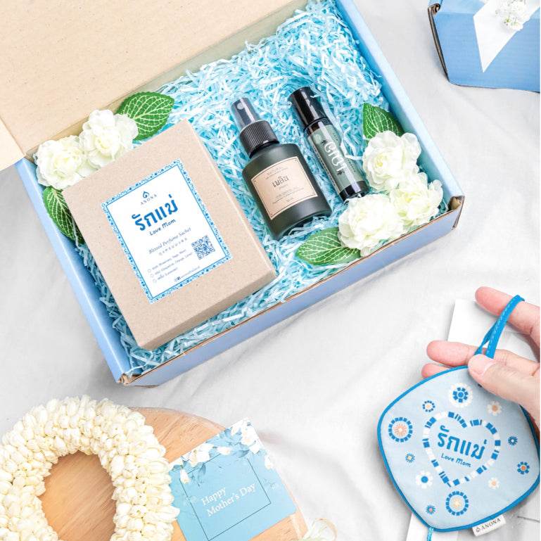 Aromatherapy gift set for mom with essential oils and floral decorations in a blue gift box from One-Sake.com