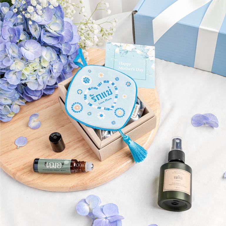 Aromatherapy gift set for mom with essential oil roller, spray bottle, and decorative pouch in a gift box