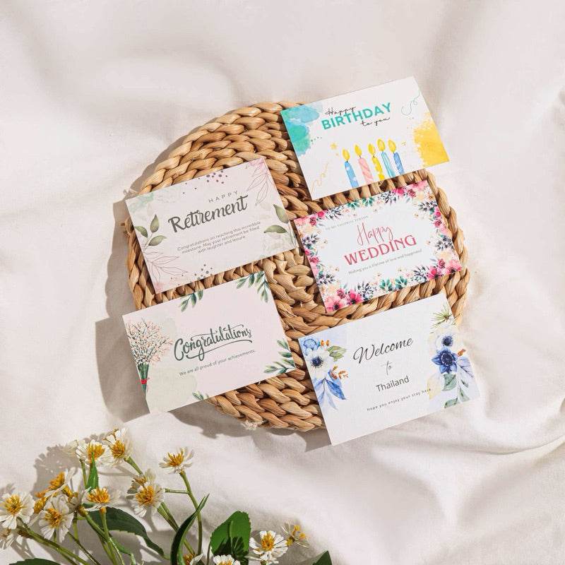 One-Sake.com aromatic wellness gift set with greeting cards on woven mat and flowers