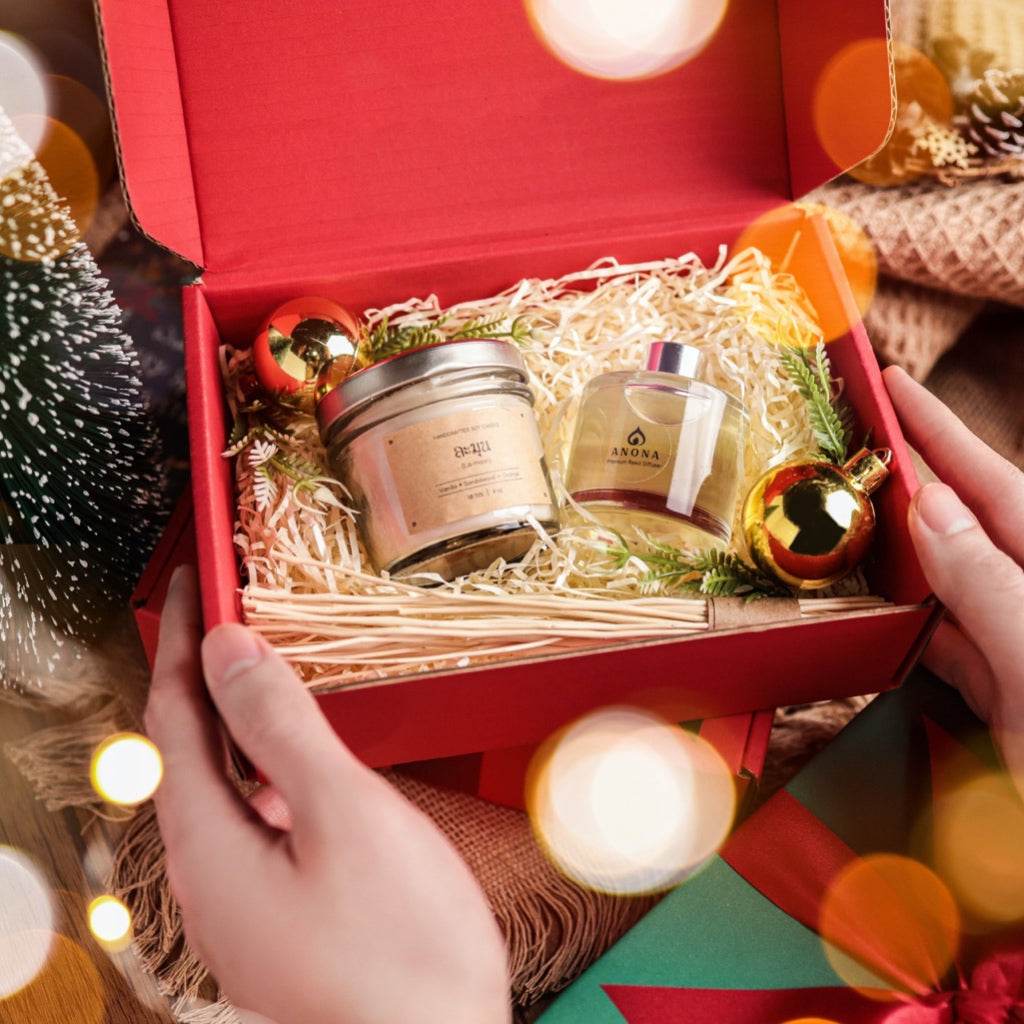 Christmas aromatherapy gift set from One-Sake.com with candle and essential oil in festive red box