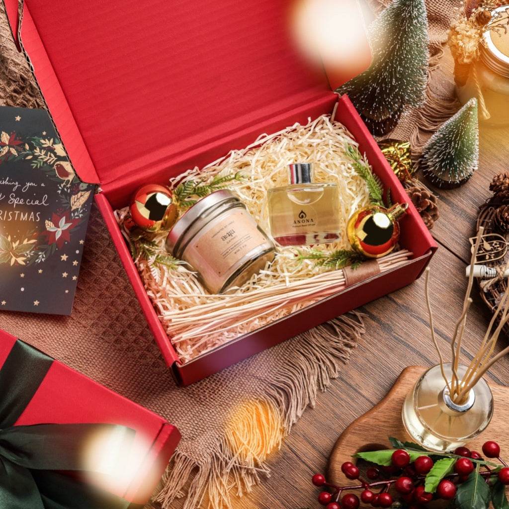 Christmas aromatherapy gift set by One-Sake.com with scented candle and essential oil in red festive box