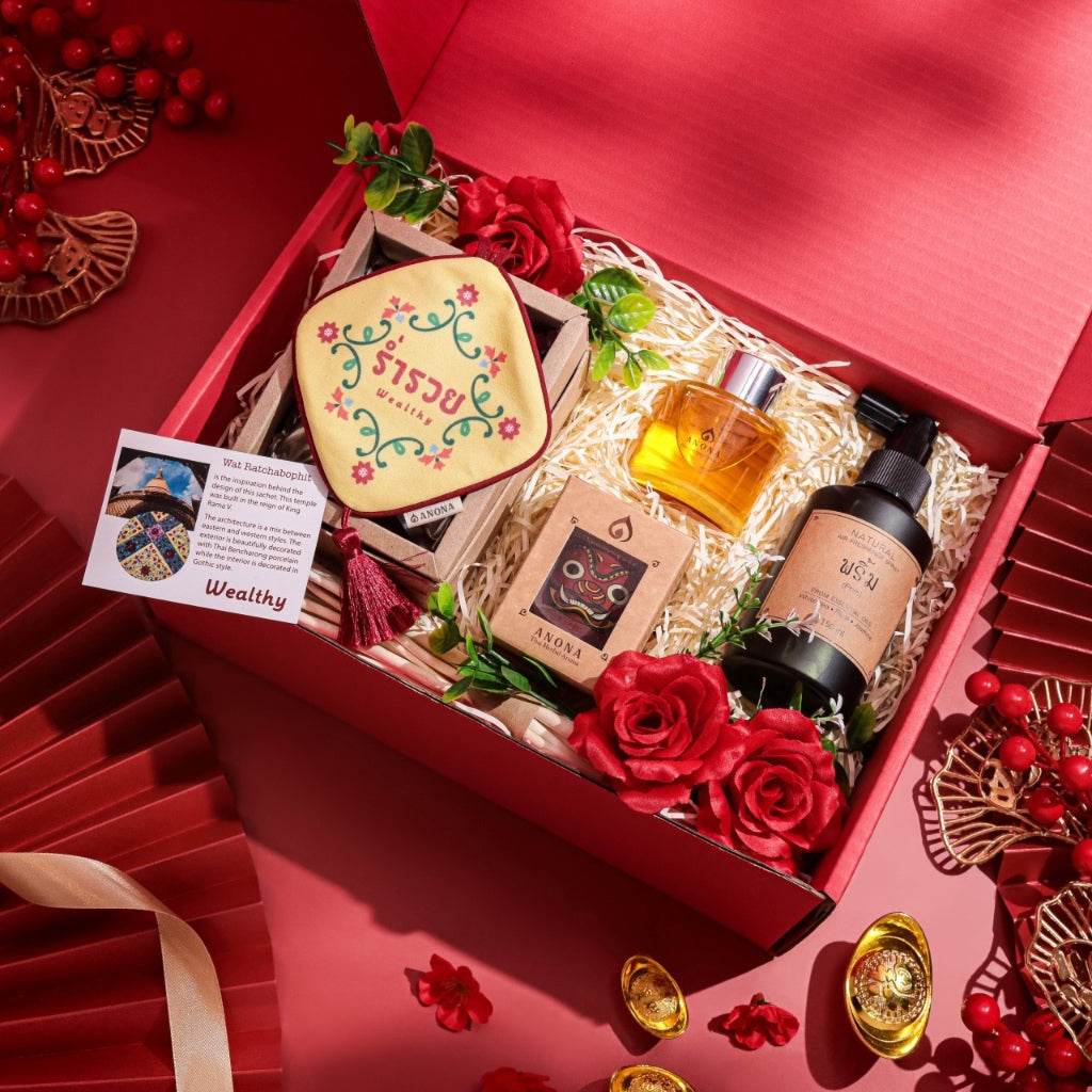 Christmas aromatherapy gift set from One-Sake.com with essential oils, lotion, and festive decorations in a red box