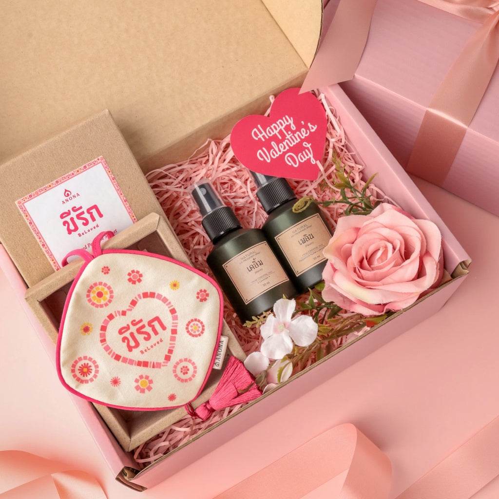 Customizable Valentine's Day gift set with scented oils, a floral sachet, and decorative rose in a pink gift box
