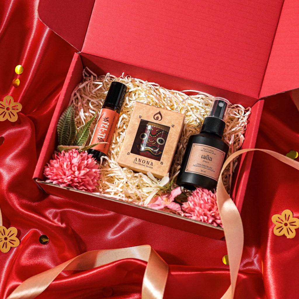 One-Sake.com essential oil roll-on bundle gift box with floral decor on red satin fabric