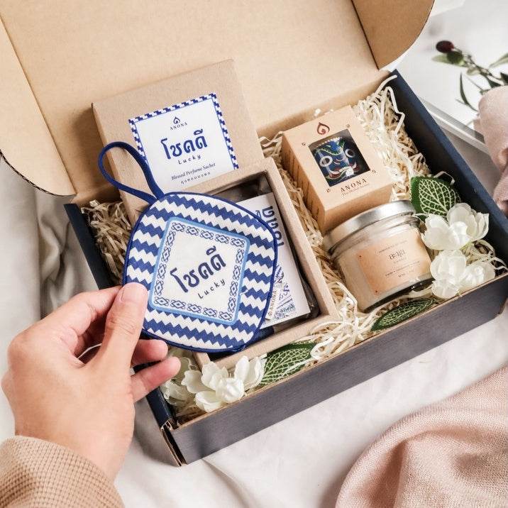 Holiday aroma gift box from One-Sake.com with scented candle, aroma oil, and decorative items