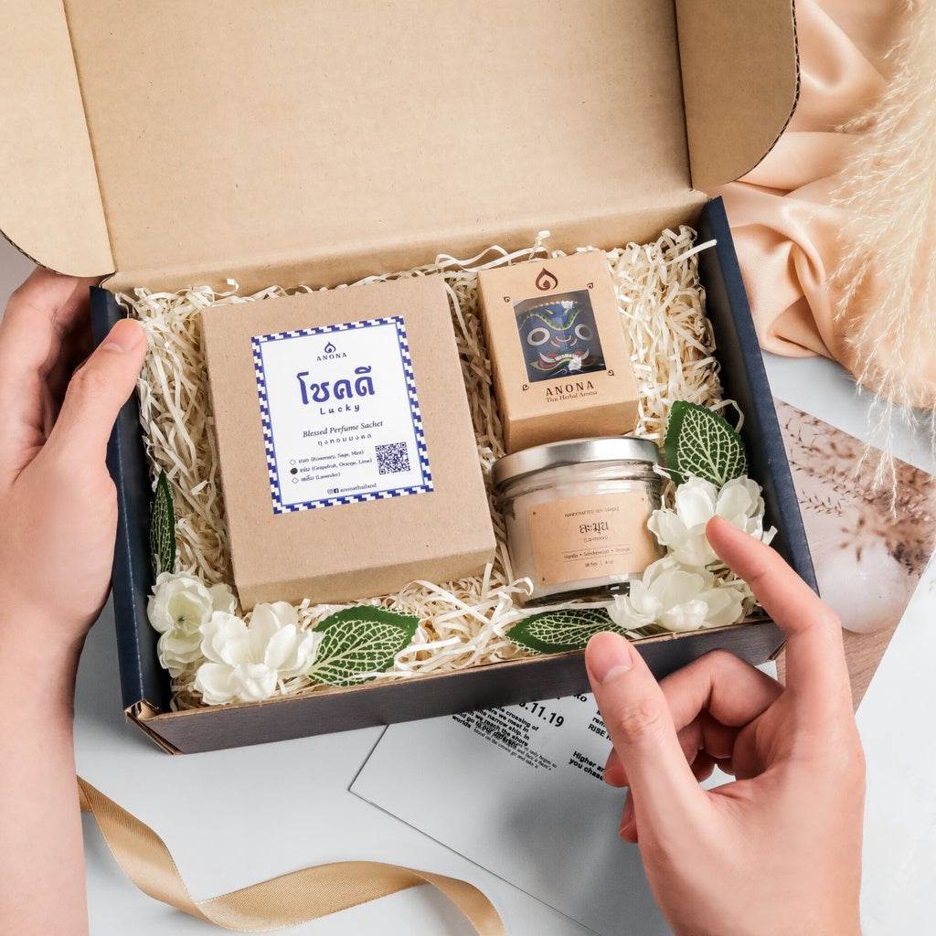 One-Sake.com holiday aroma gift box with natural scented candle, essential oil, and decorative flowers in a gift package