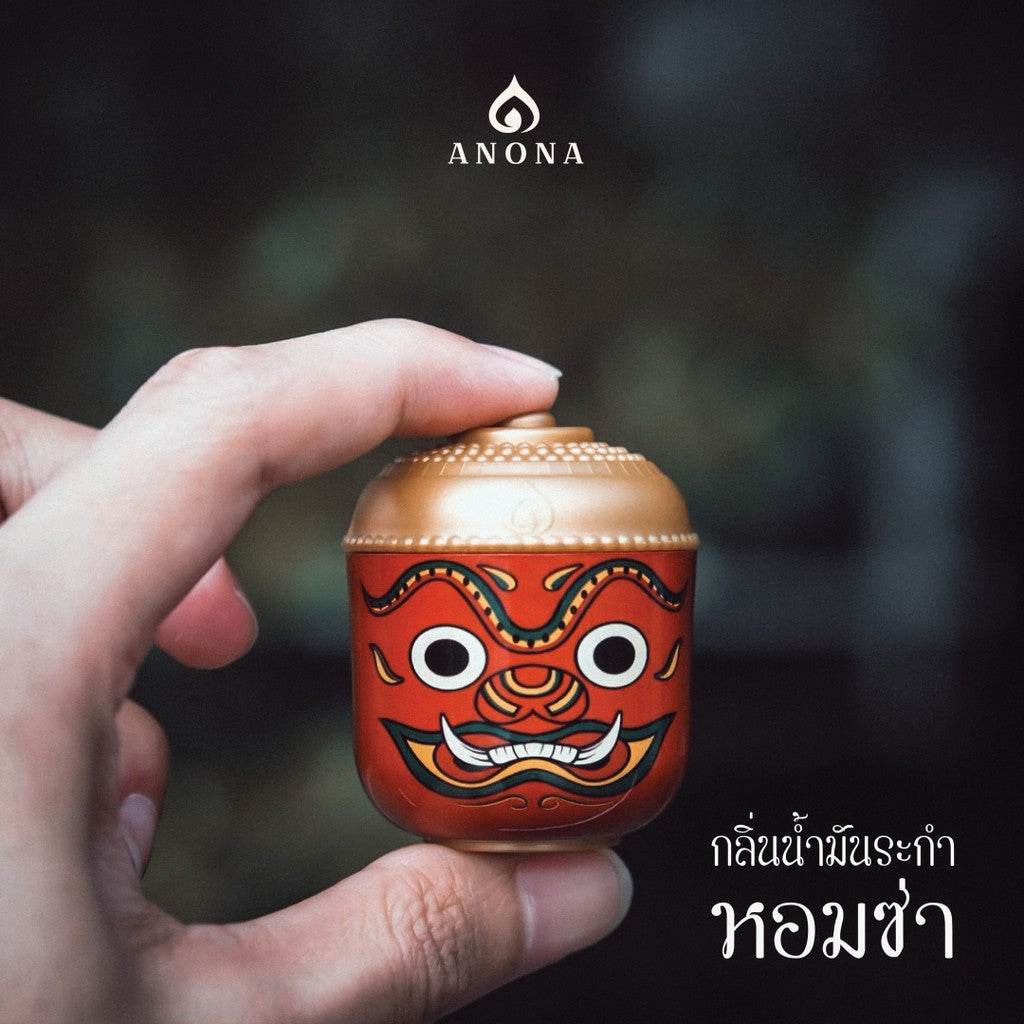 Hand holding a traditional red and gold container from One-Sake.com natural aroma box set for adults