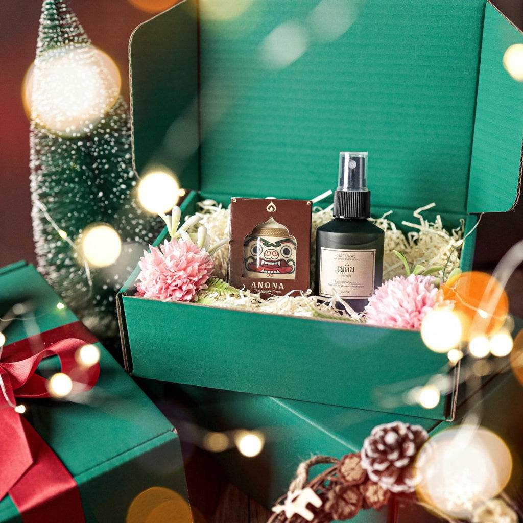 Natural herbal gift set in green box featuring aromatic spray and herbal soap with decorative pink flowers