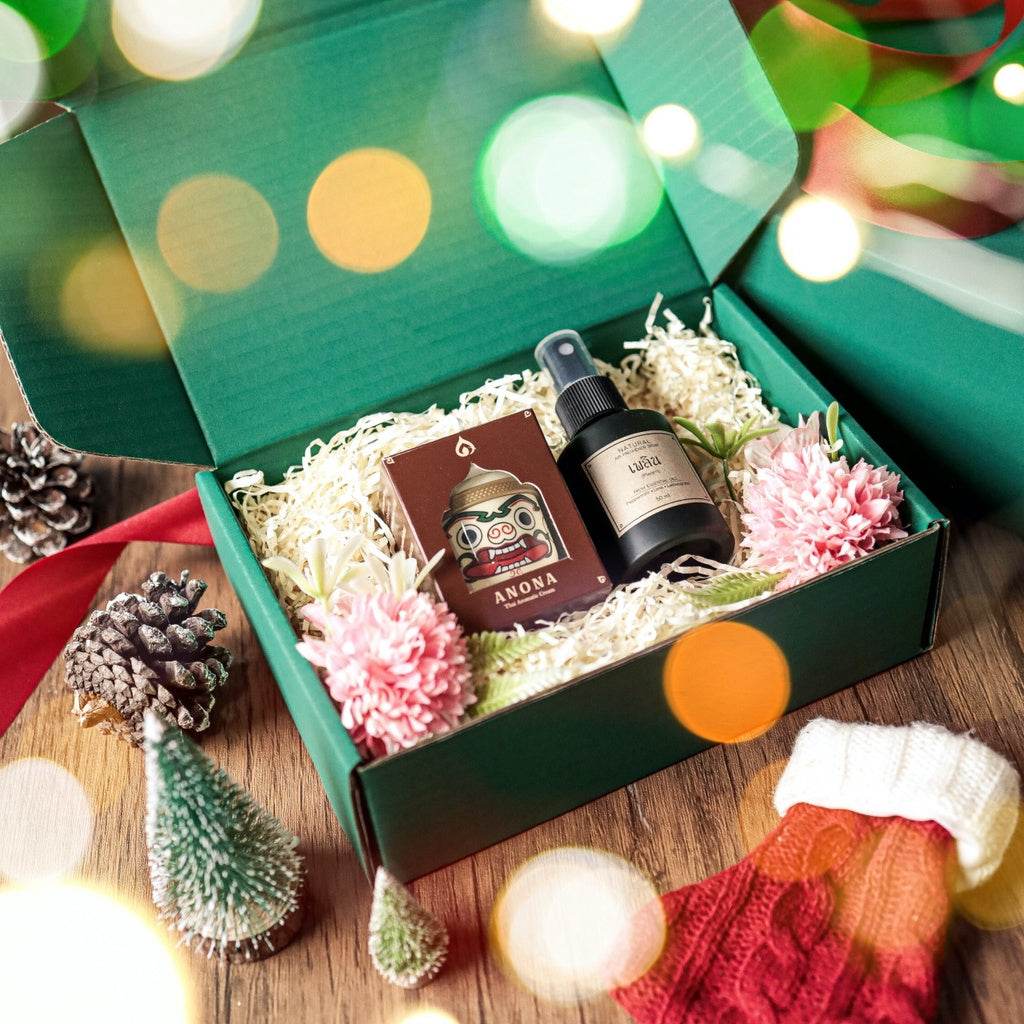 Natural herbal gift set in green box with spray bottle, candle, and decorative flowers from One-Sake.com