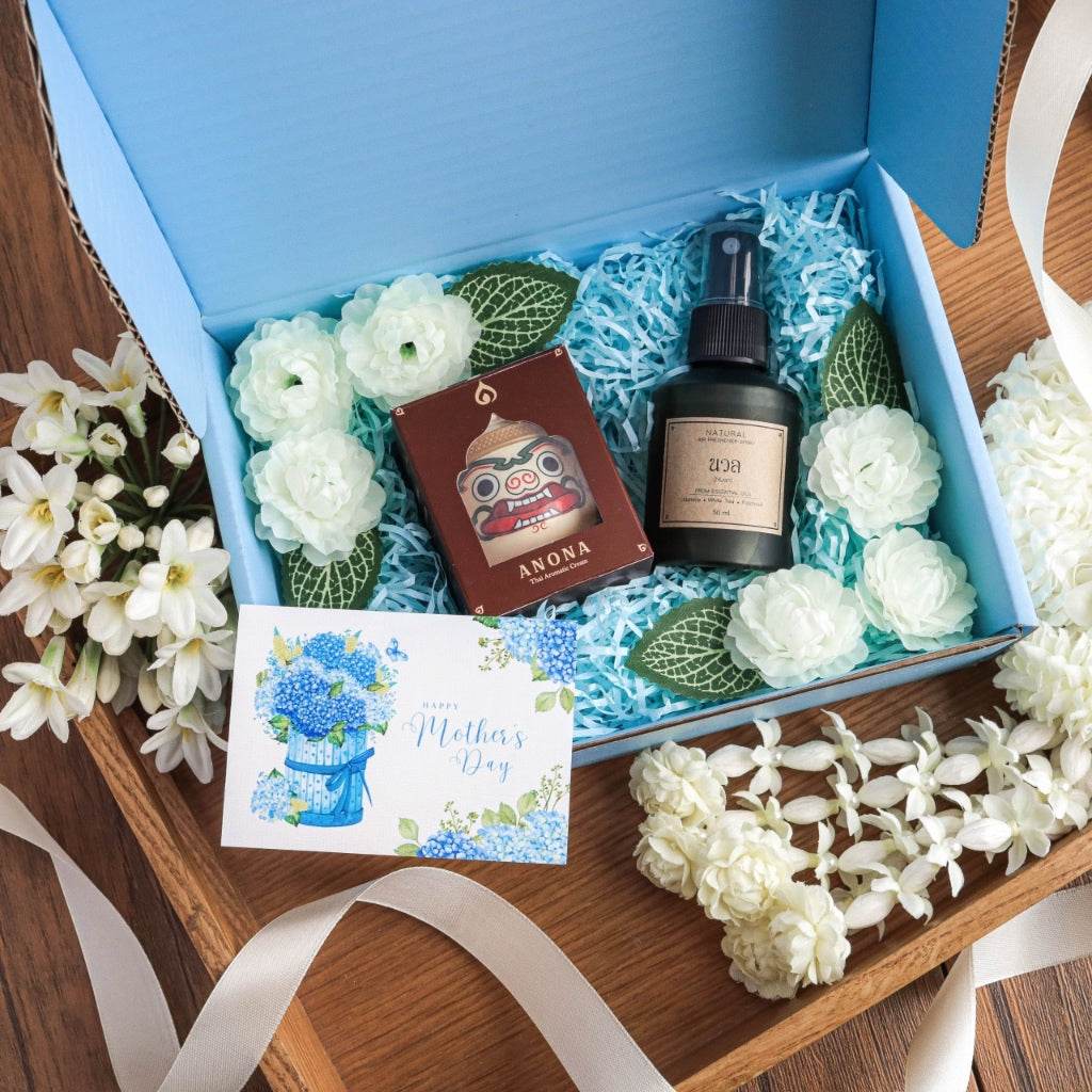One-Sake natural soothing balm and room spray set with decorative white flowers in blue gift box