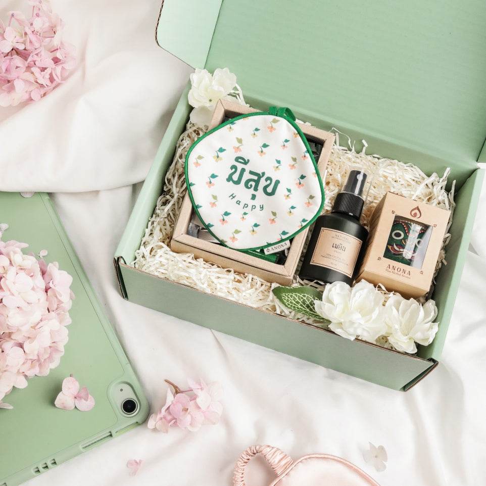 Pastel green aromatherapy gift set with spray bottle, candle, and pouch in a green box by One-Sake.com