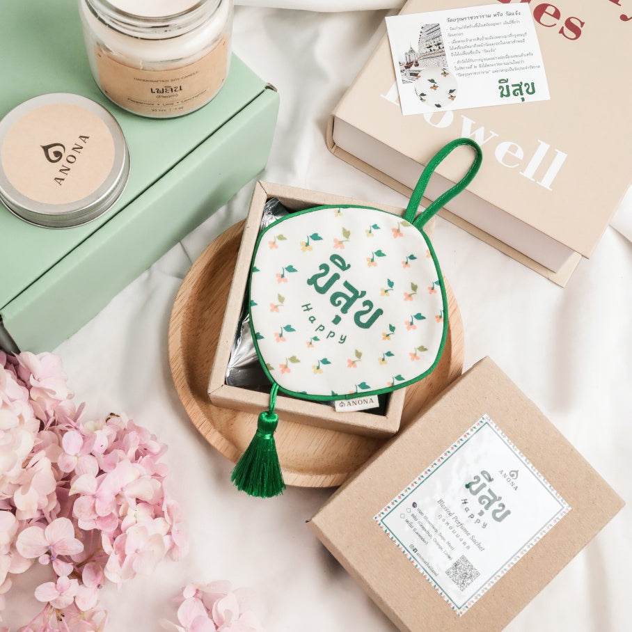 Pastel green aromatherapy gift set with a floral pouch, scented candle, and eco-friendly packaging from One-Sake.com