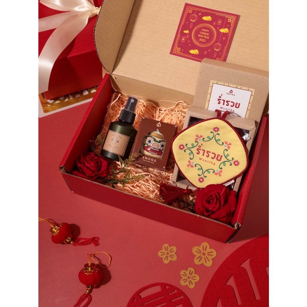 One-Sake.com premium aromatherapy gift box with essential oil spray, scented candle, decorative roses, and festive packaging