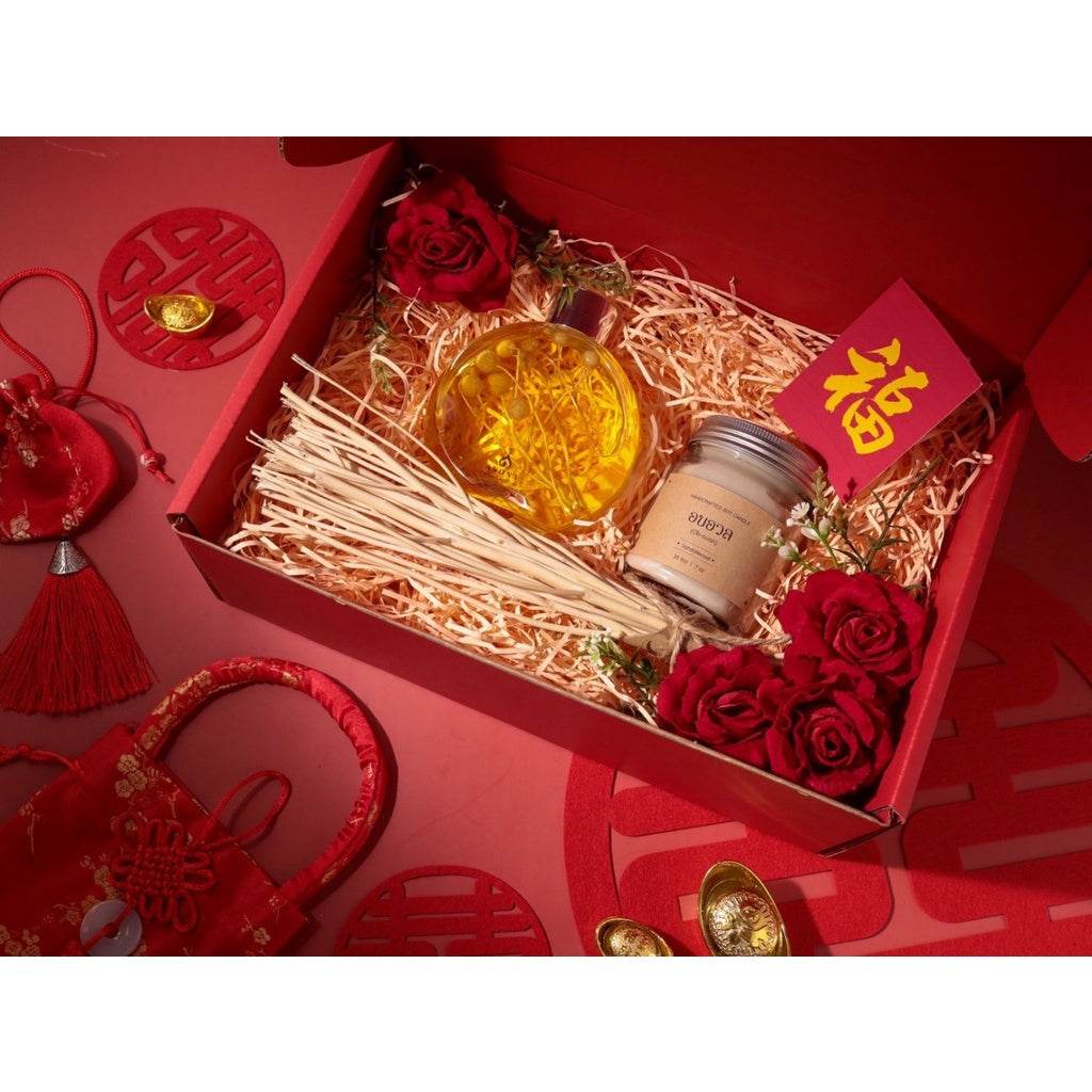 One-Sake.com premium aromatherapy gift box with diffuser oil, candle, red roses, and festive decorations