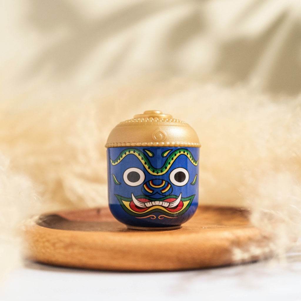 One-Sake.com Thai herbal aroma sachet in decorative blue and gold container with traditional design