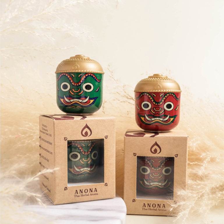 Thai herbal aroma sachet in decorative green and red containers with gold lids on branded Anona boxes