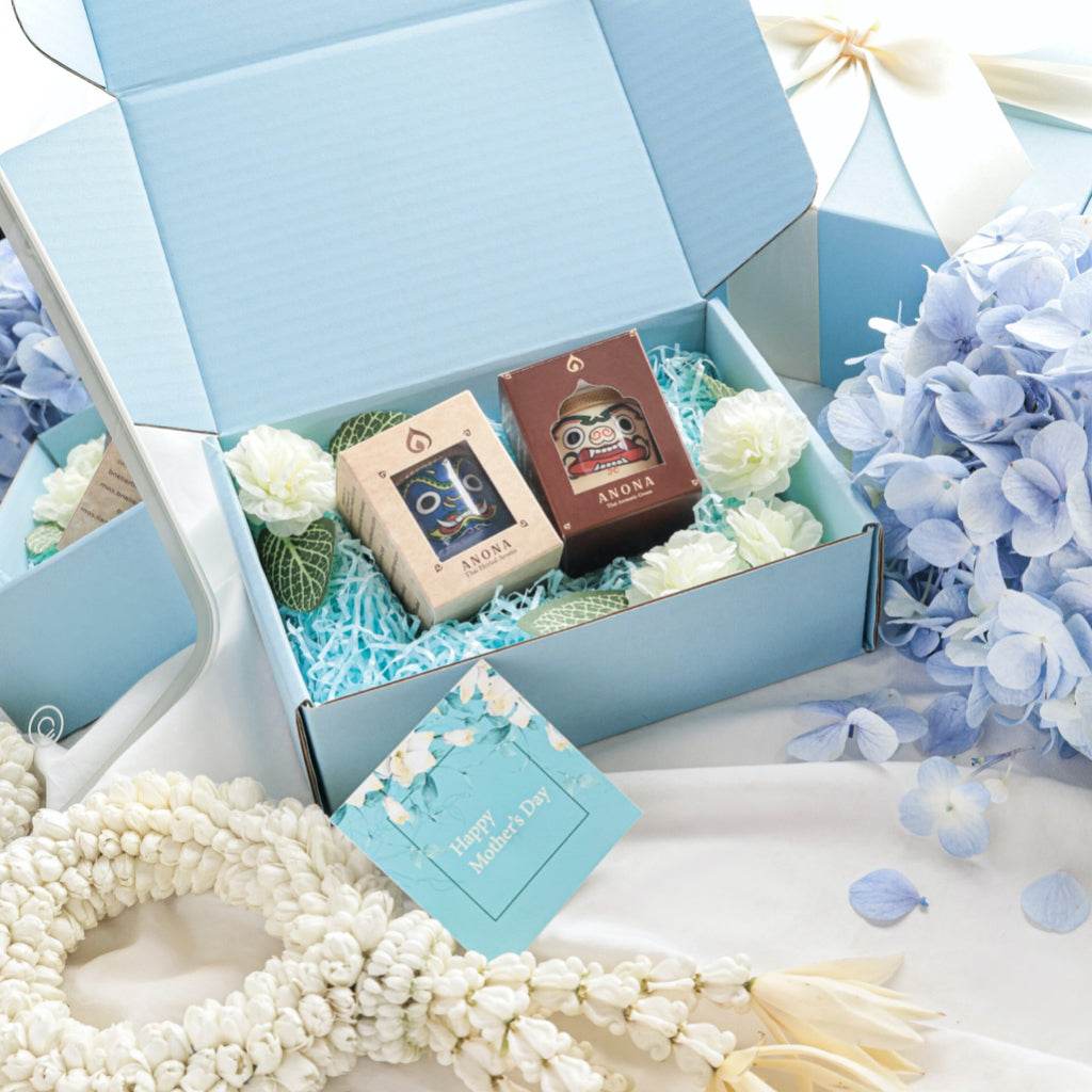 Thai herbal gift set for mom with aromatic products in a blue gift box with flowers and a holiday card