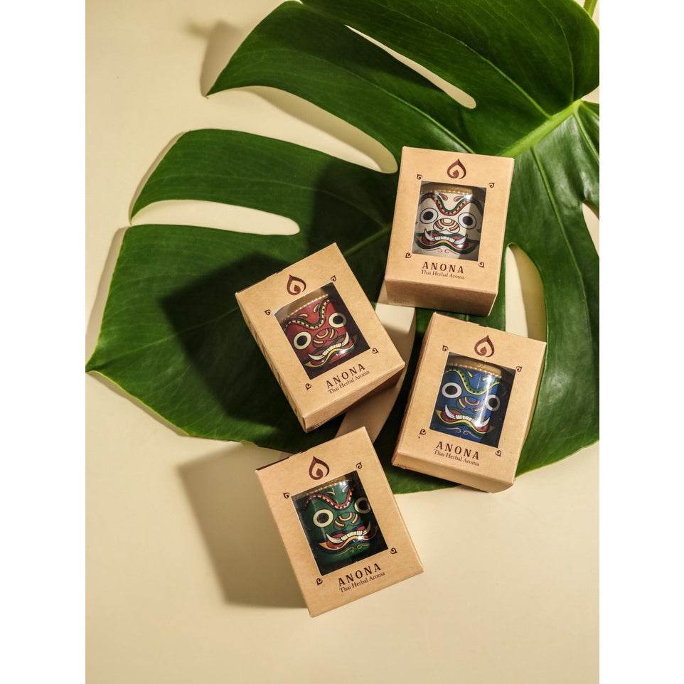 Unique Thai gift box set with colorful traditional mask designs by One-Sake.com on green leaves