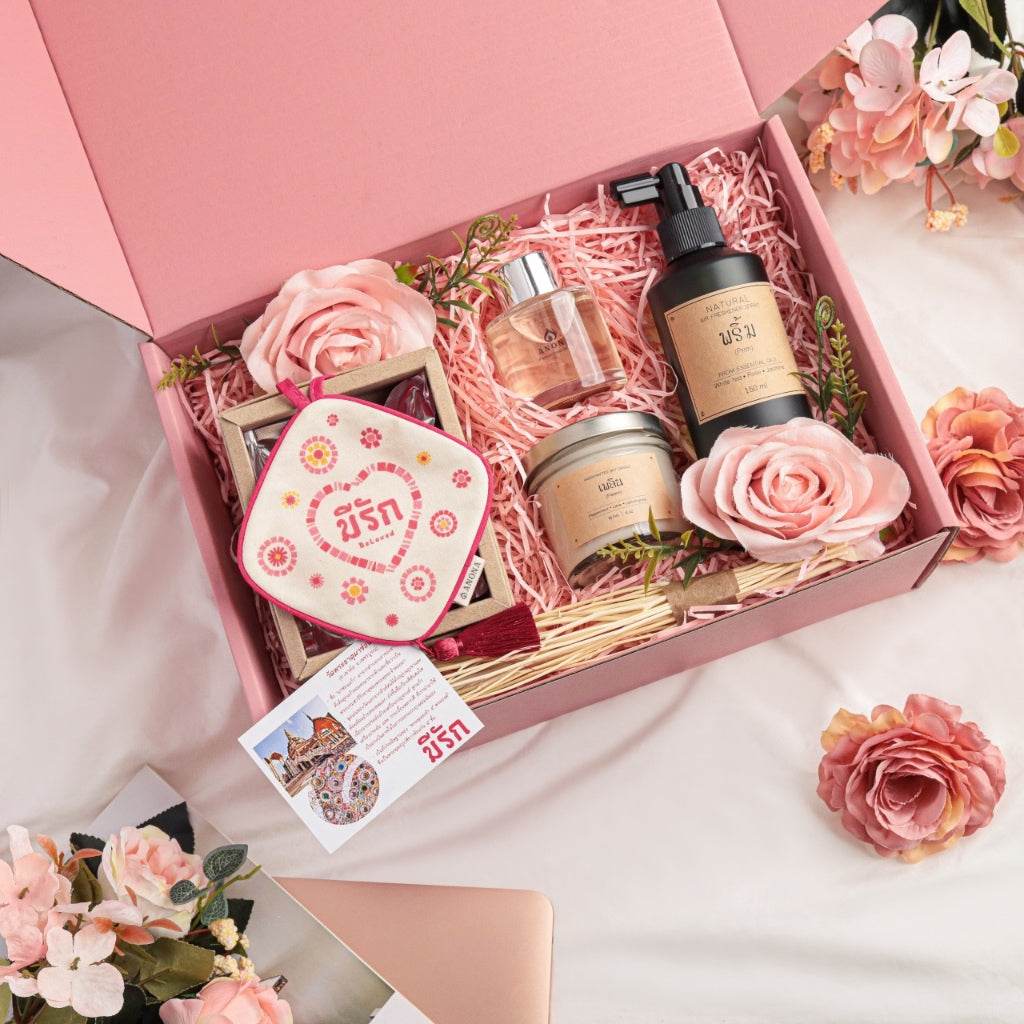 Valentine's Day soy candle collection gift set with floral decor, fragrance oils, and body care products