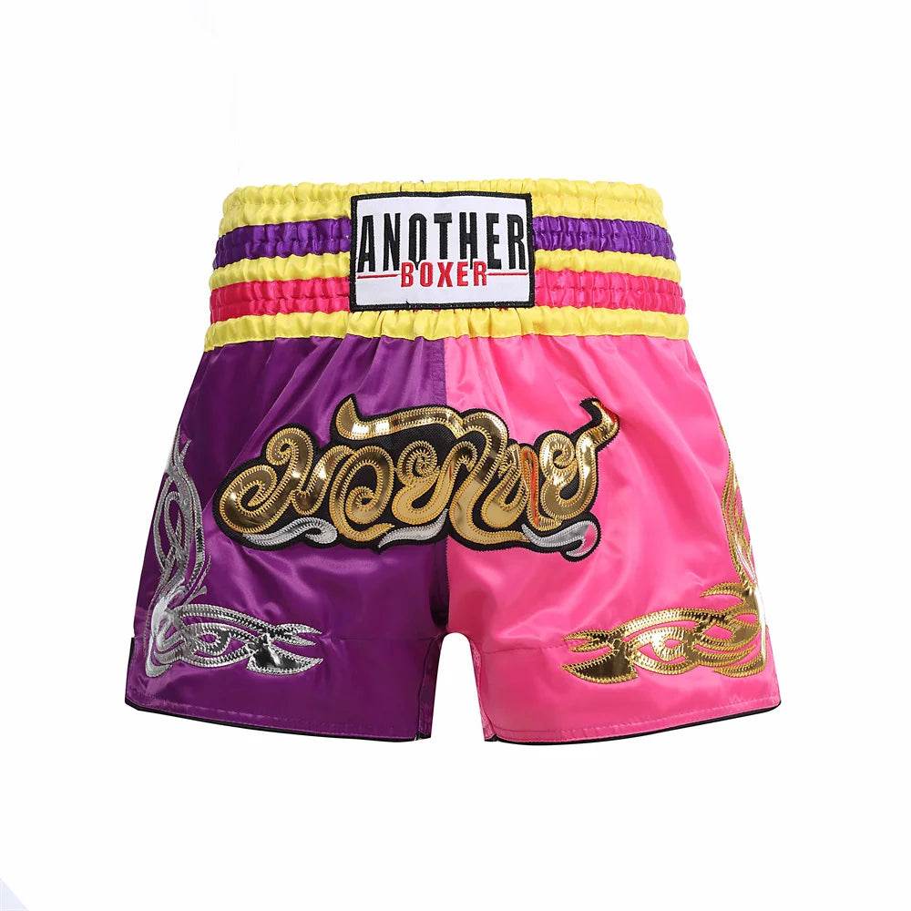 Thai Blessing Co Muay Thai boxing shorts in pink and purple with yellow waistband and gold embroidery