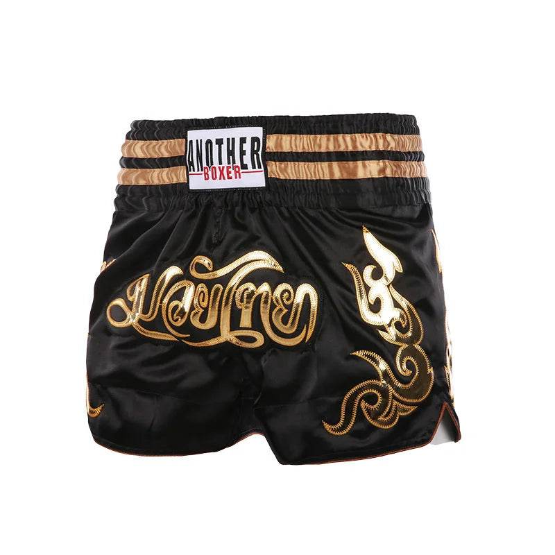 Muay Thai boxing shorts unisex black satin shorts with gold Thai script and decorative trim for training