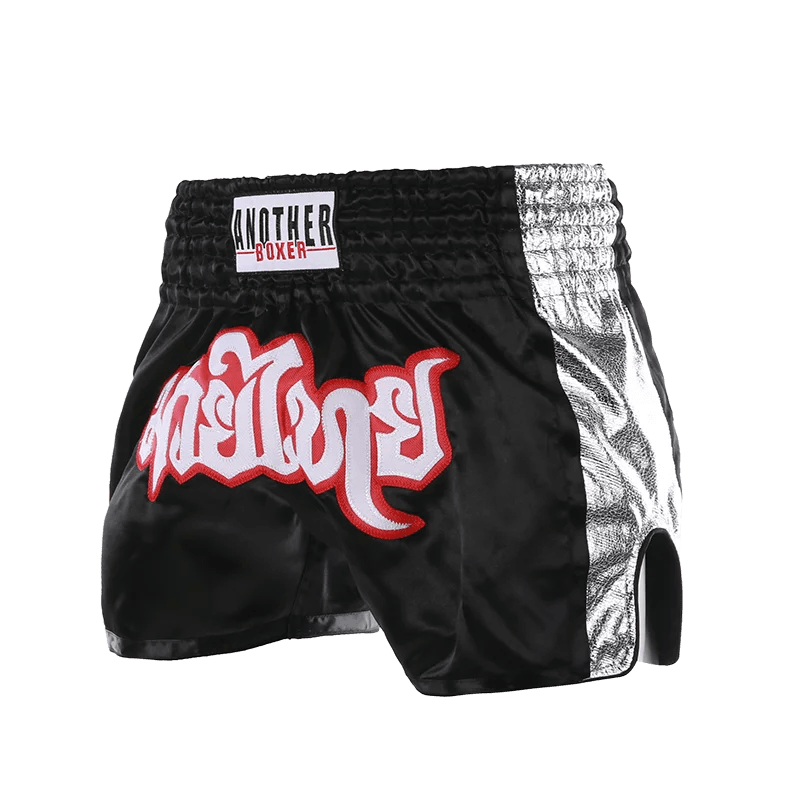 Muay Thai boxing shorts unisex black satin shorts with silver side panels and red white Thai script logo