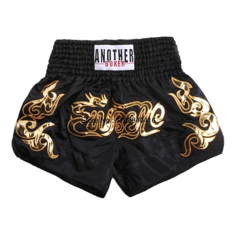 Thai Blessing Co black satin kickboxing trunks for men and women with gold dragon embroidery and elastic waistband