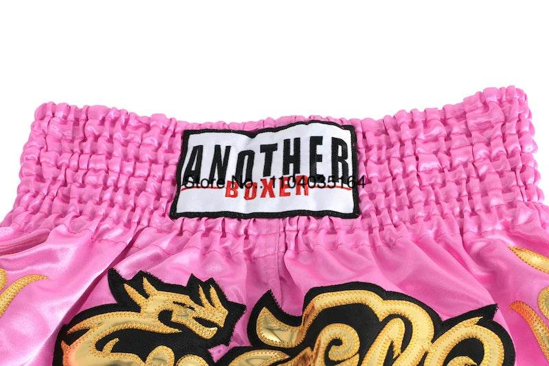 Pink dragon embroidered satin kickboxing trunks for men and women with wide elastic waistband by Thai Blessing Co