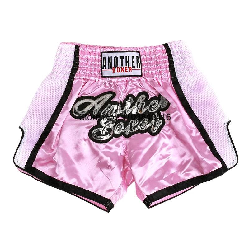 Pink satin Muay Thai shorts with black trim and elastic waist by Thai Blessing Co satin kickboxing trunks for men and women