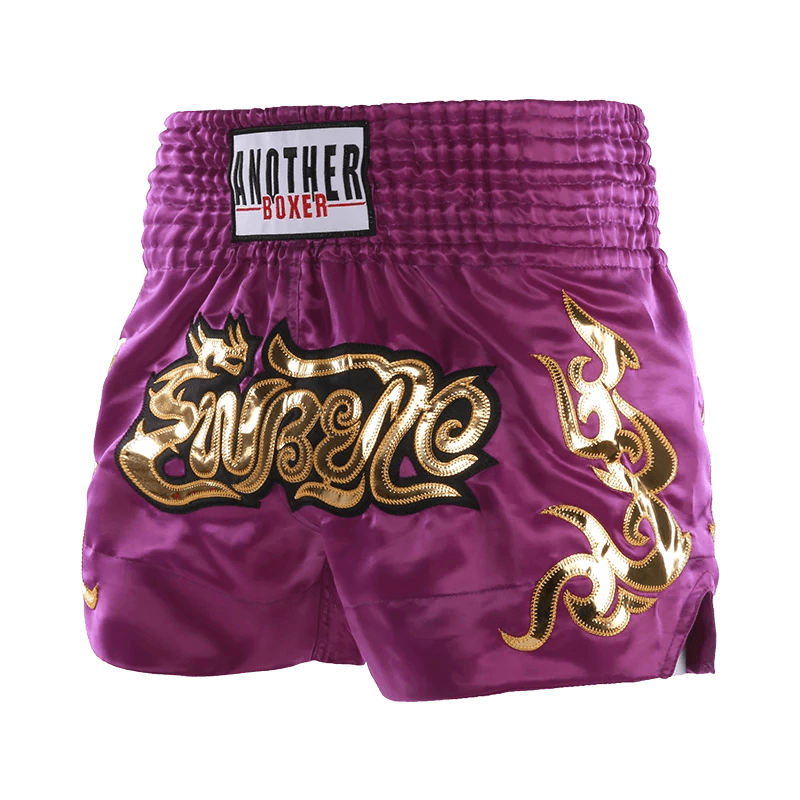 Purple satin Muay Thai shorts unisex with gold Thai embroidery and elastic high waistband Another Boxer label