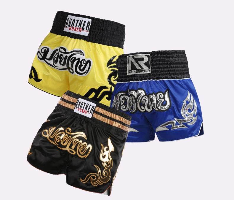 Muay Thai shorts unisex set of three satin fight shorts in yellow blue and black with Thai script designs