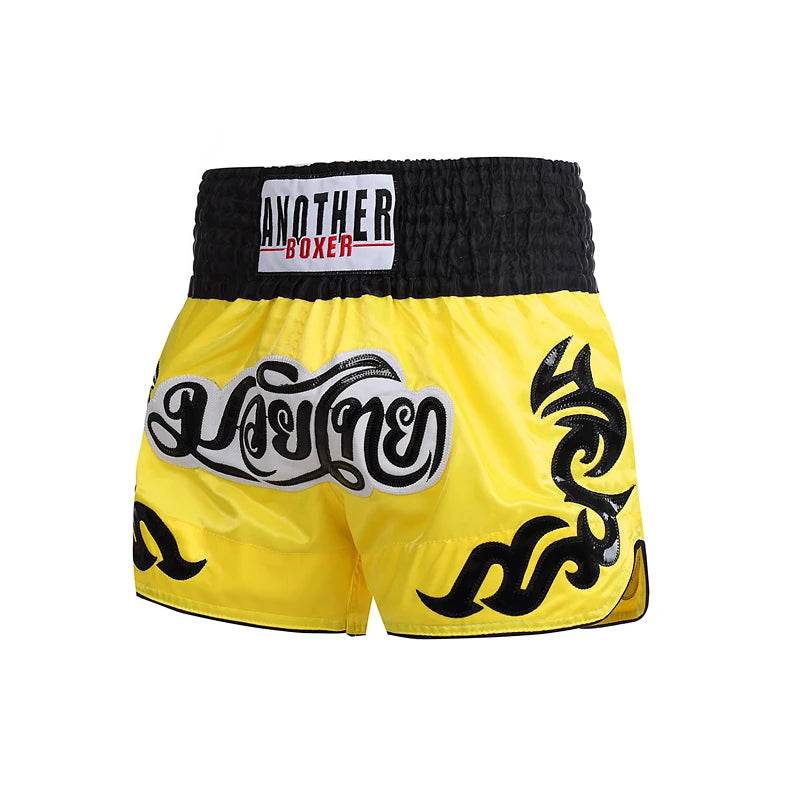 Muay Thai shorts unisex yellow Thai boxing shorts with black smocked waistband tribal designs and Thai script