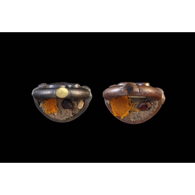Attamano 9 auspicious Buddha amulet set two worn bronze and black amulet bases showing saffron cloth relics