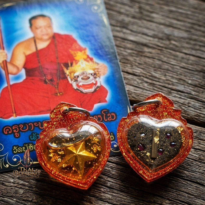 Authentic Thai Attraction Amulet "Dao Huachai Nari Mystical Heart Star Pendant Encased in Sacred Charm Oil & Red-Orange Glitter Frame"