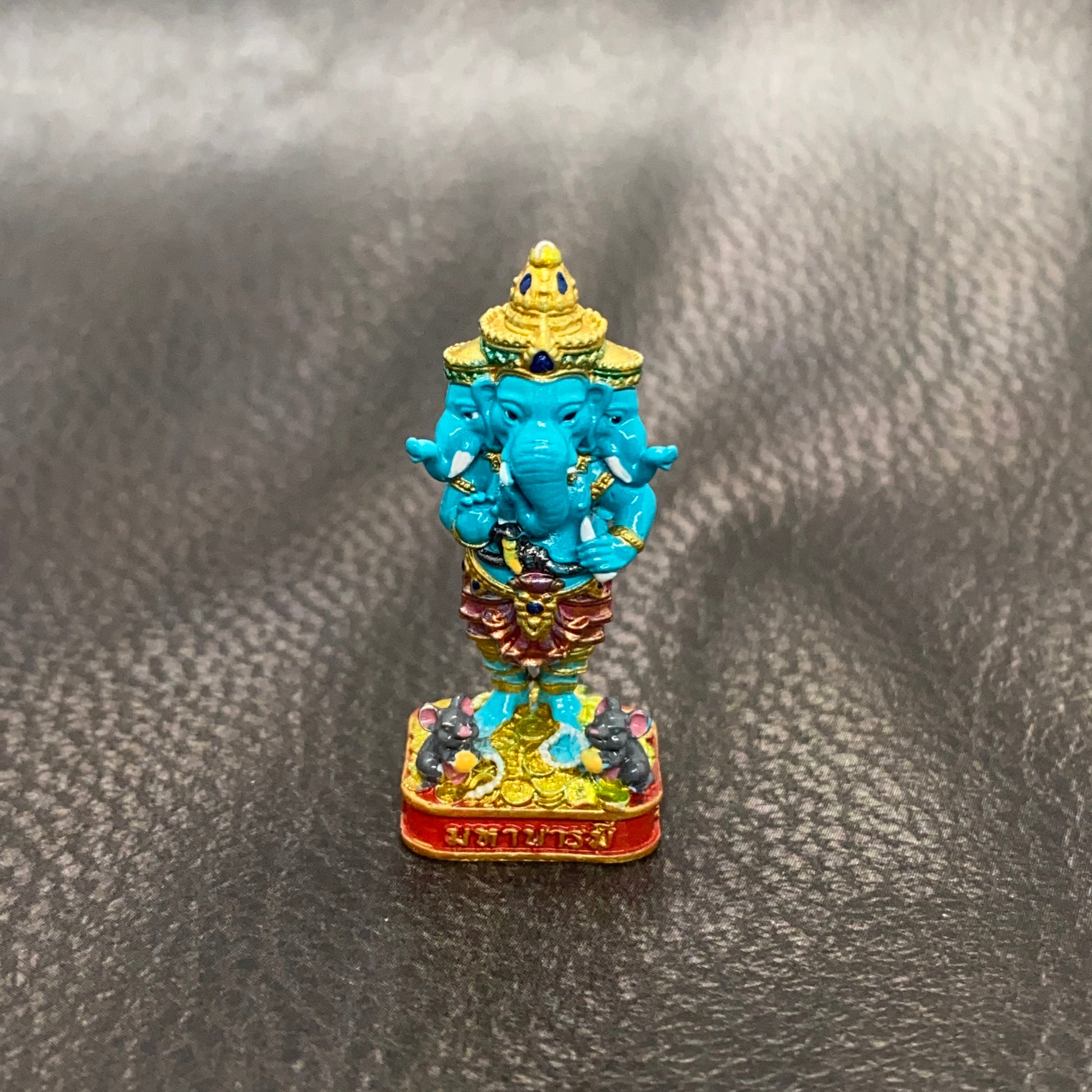 Authentic Thai Ganesha amulet intricately designed with vibrant colors and detailed features