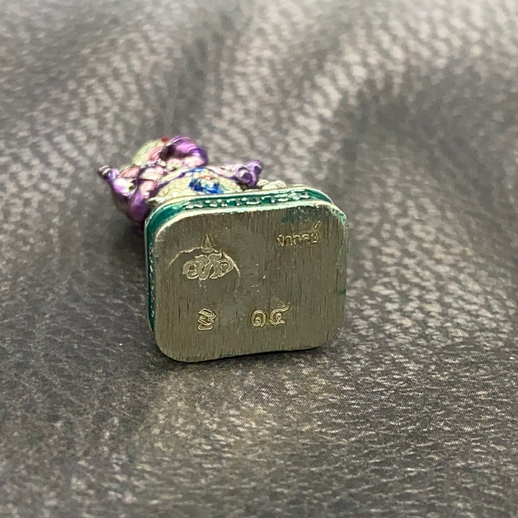 Authentic Thai Ganesha amulet with detailed craftsmanship and vibrant colors, showcasing Thai culture