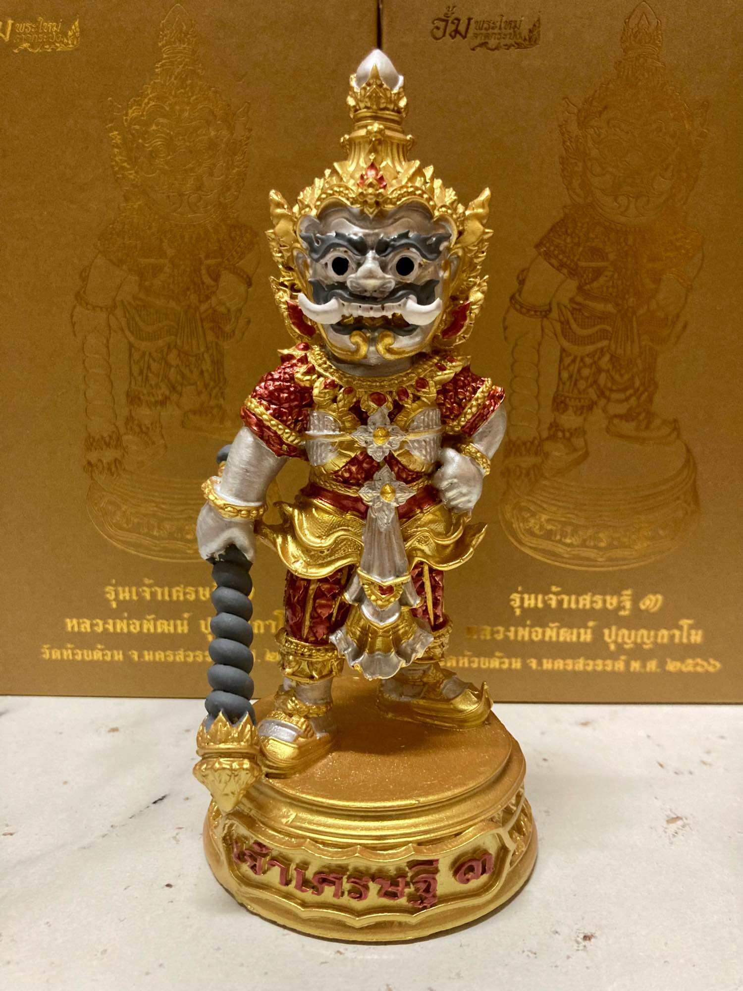 Authentic Thai lucky charm for prosperity featuring a detailed figurine with vibrant colors
