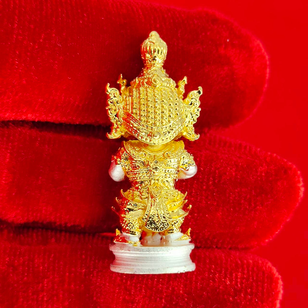 Authentic Thai protective amulet featuring intricate gold detailing and religious motifs for home decoration