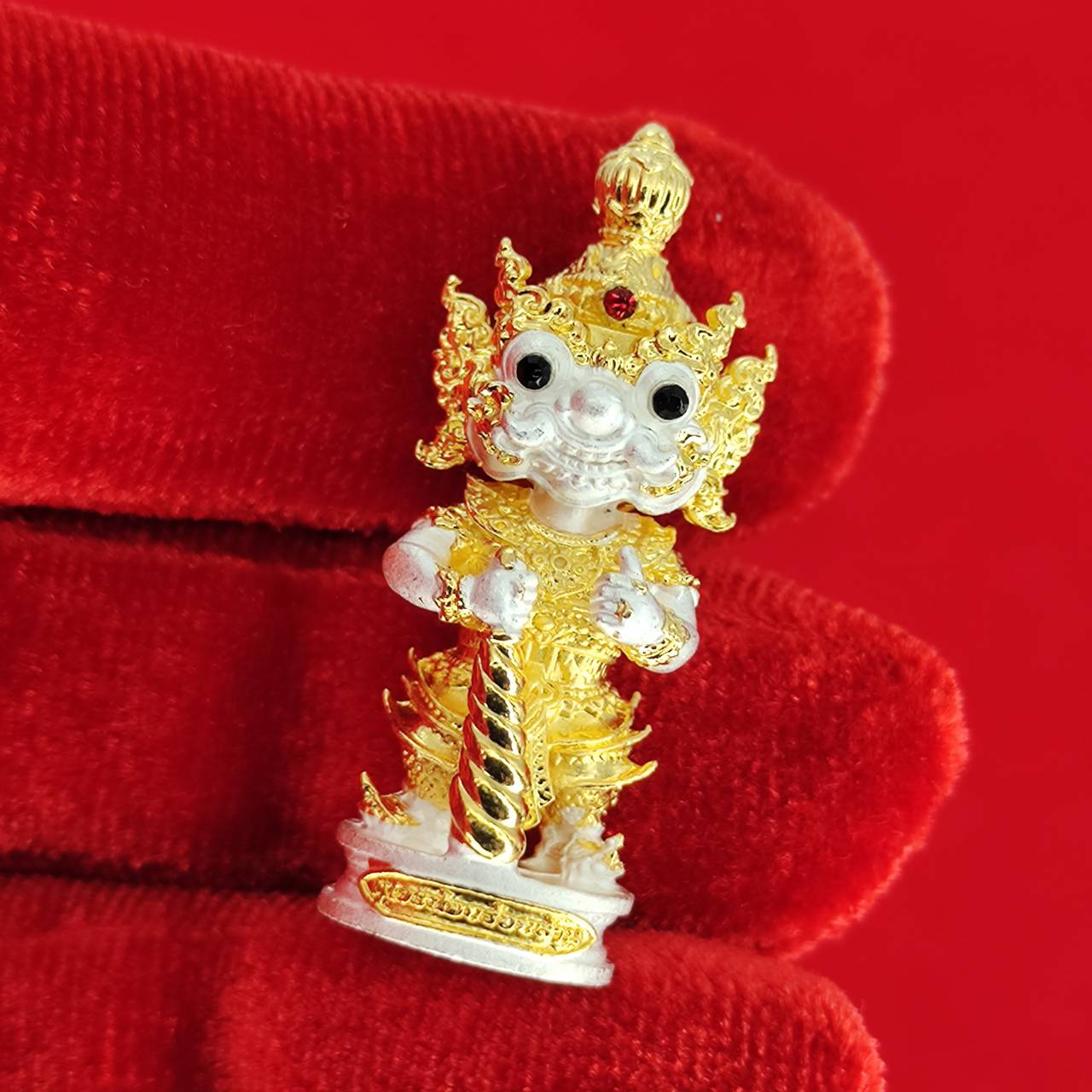 Authentic Thai protective amulet featuring a detailed golden statue for home decoration