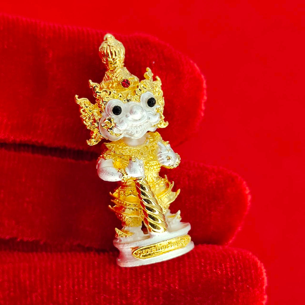 Authentic Thai protective amulet depicting a guardian deity with intricate gold details