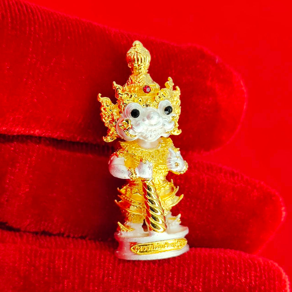 Authentic Thai protective amulet featuring intricate gold detailing and a vibrant design for spiritual protection