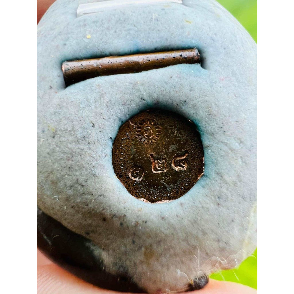 Close-up of Bai Kae Supreme Protection amulet detail with engraved symbols from Thai Blessing Co