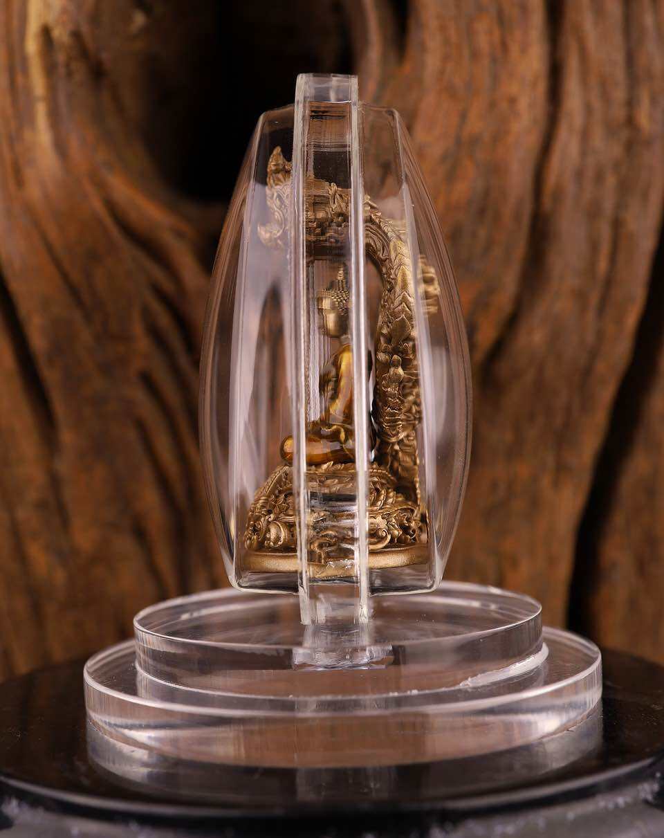 Phra Nak Prok statue bronze amulet pendant in clear protective case on display stand Thai Blessing Co